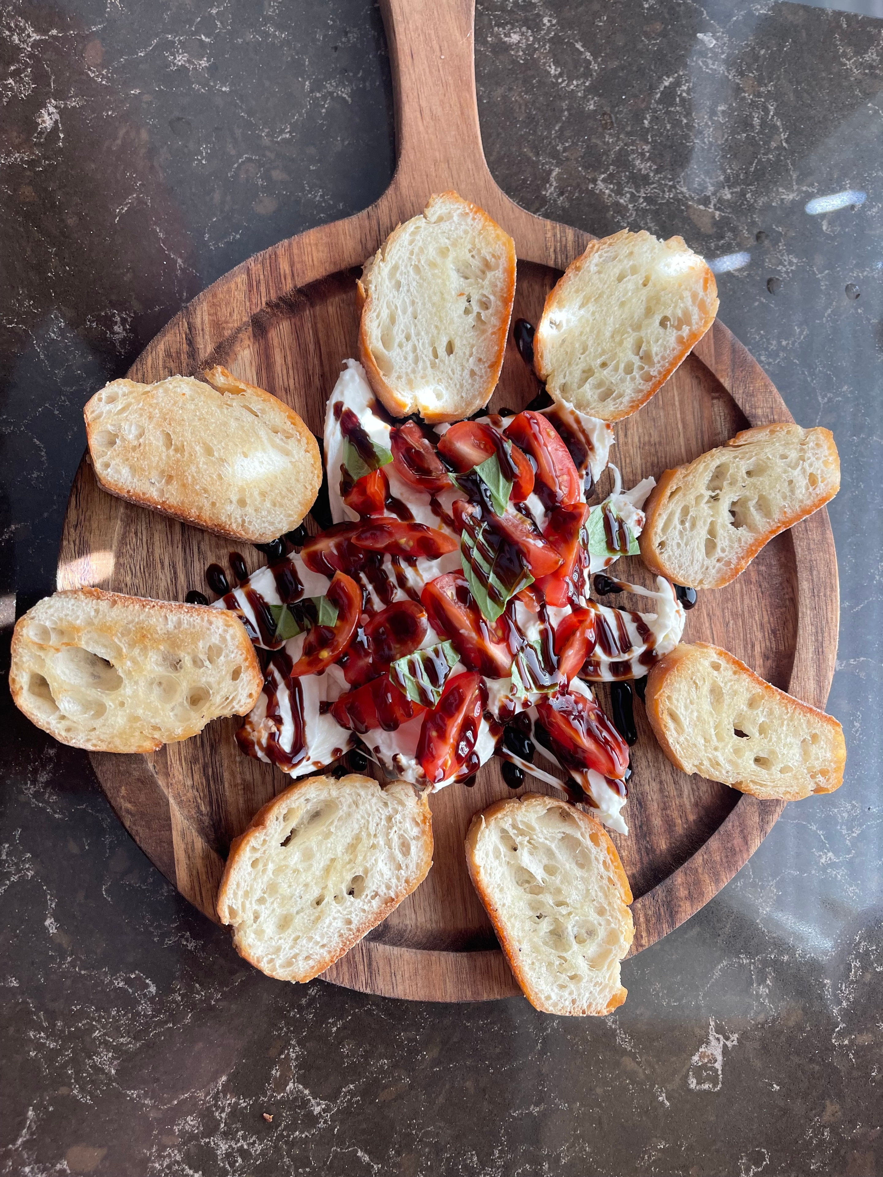 Burrata bruschetta with tomatoes and balsamic drizzle at The Social Cellar